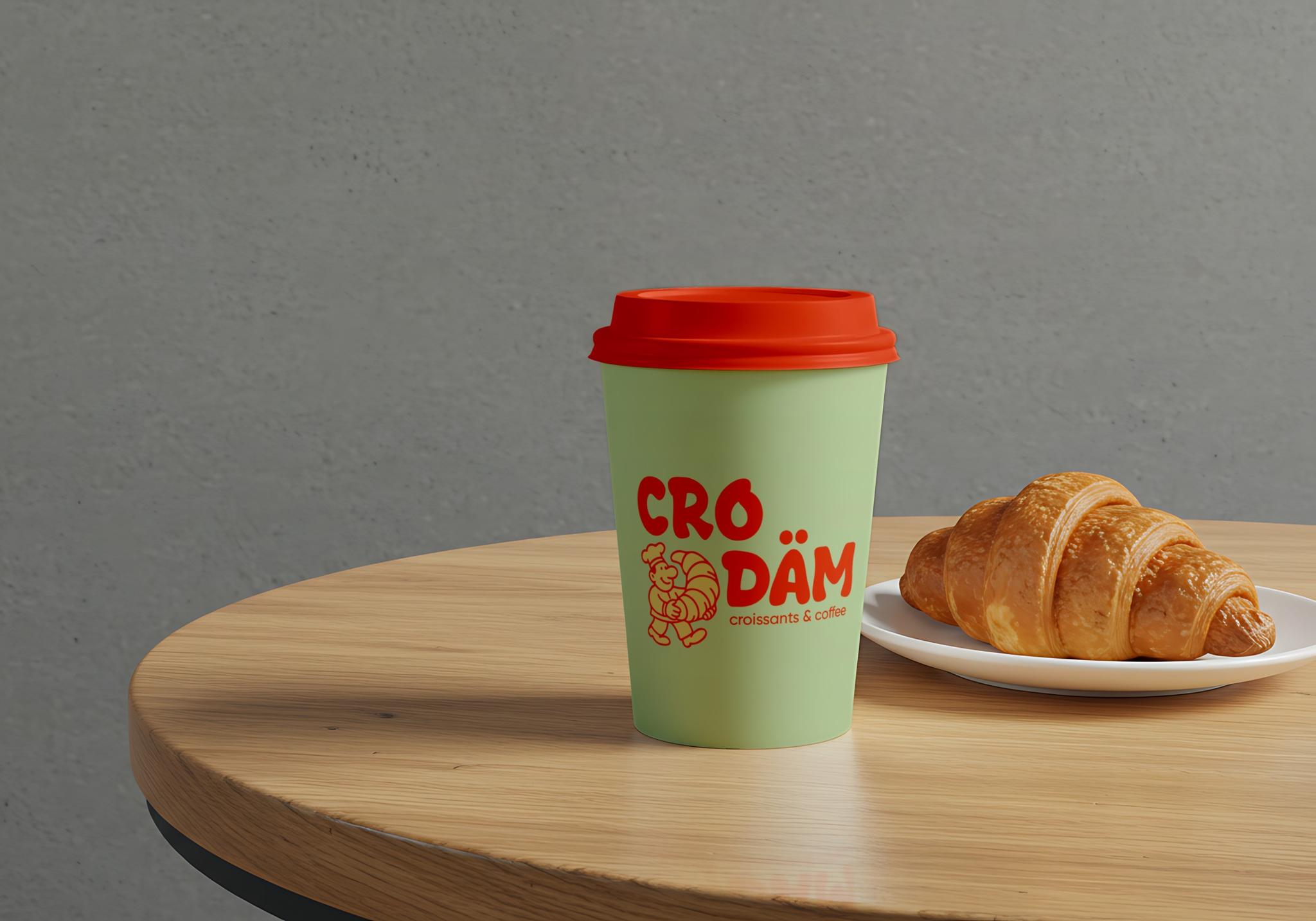 CRO DÄM — стакан и круассан